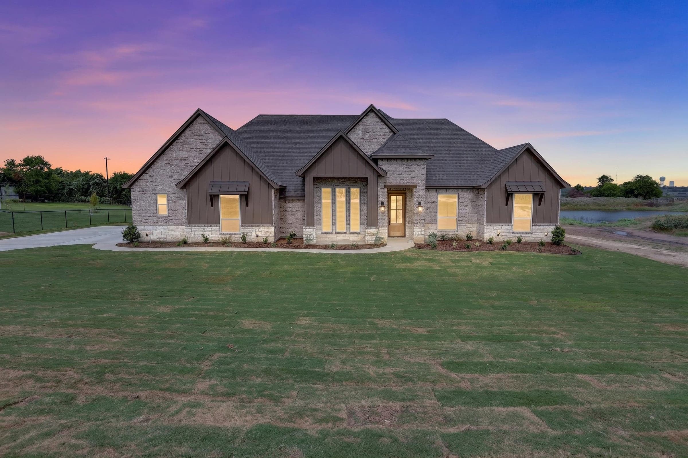 Twilight exterior of the completed home at 471 Red Bird Drive.