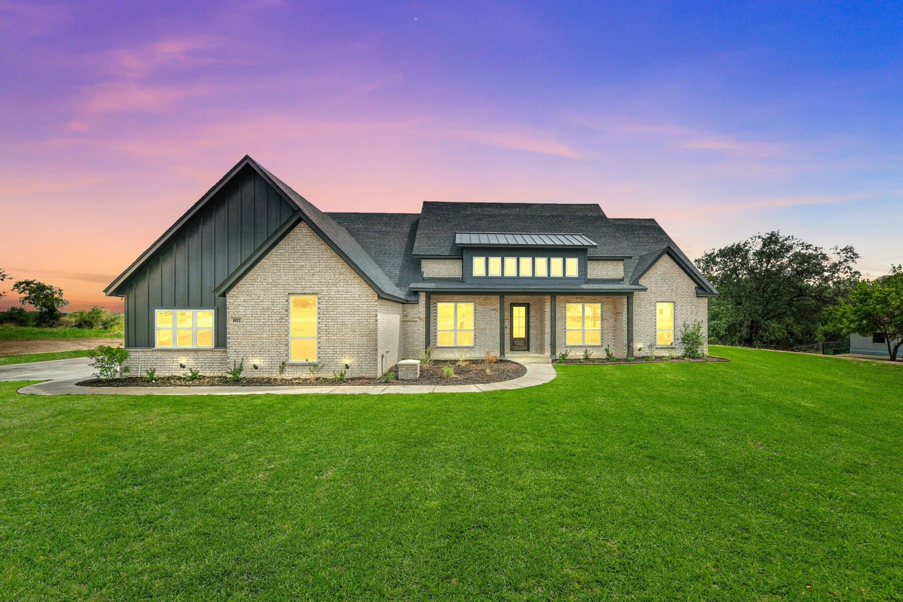 Evening exterior of an Abba River Homes build in Peaster, Texas.